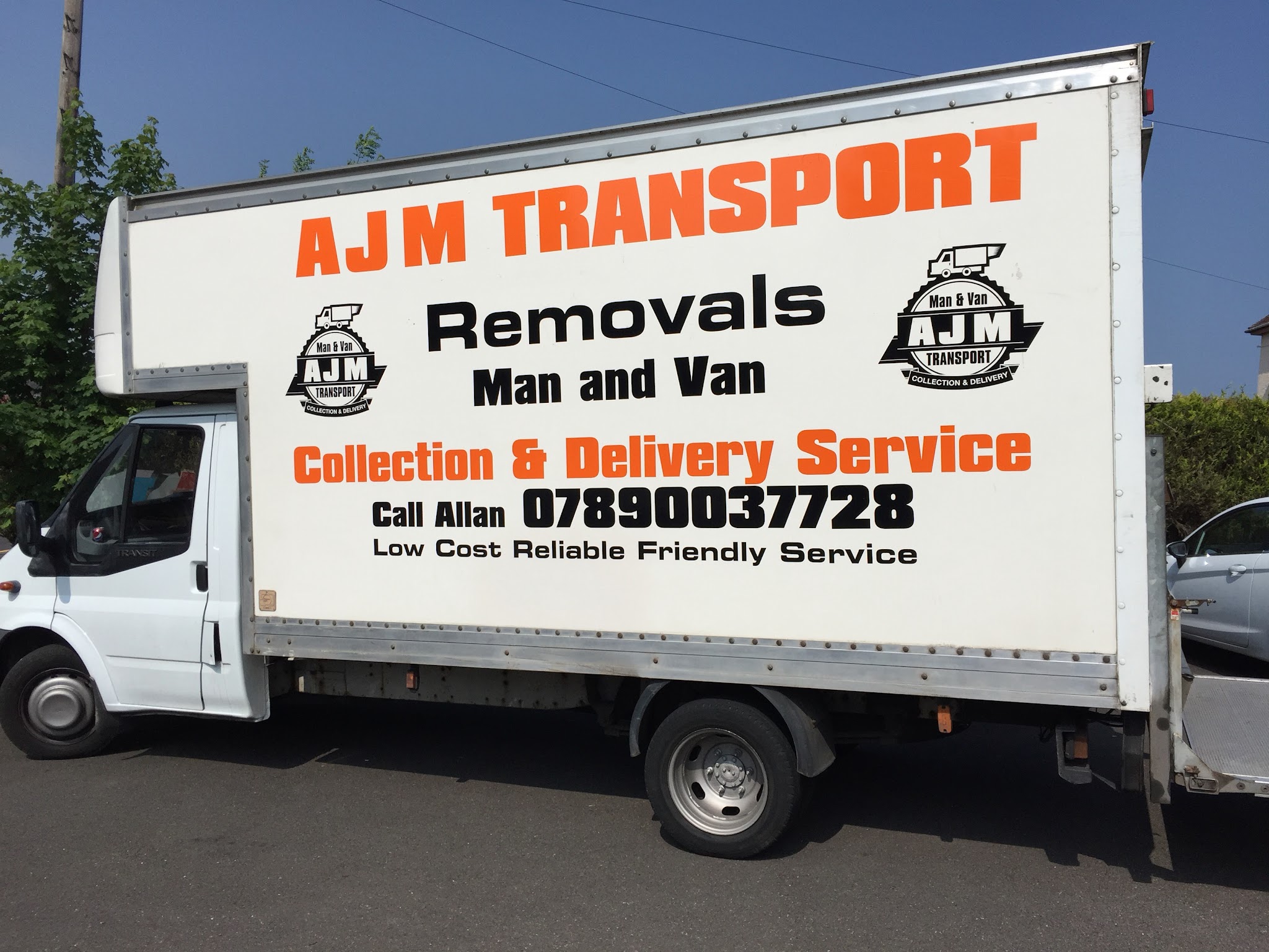 The side of an AJM Transport Luton van: Removals, Man and Van, Collection and Delivery Service, Call Allan